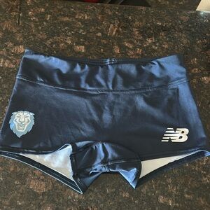 NWOT Women’s small New Balance running shorts /boy shorts. Columbia Blue w/ Lion
